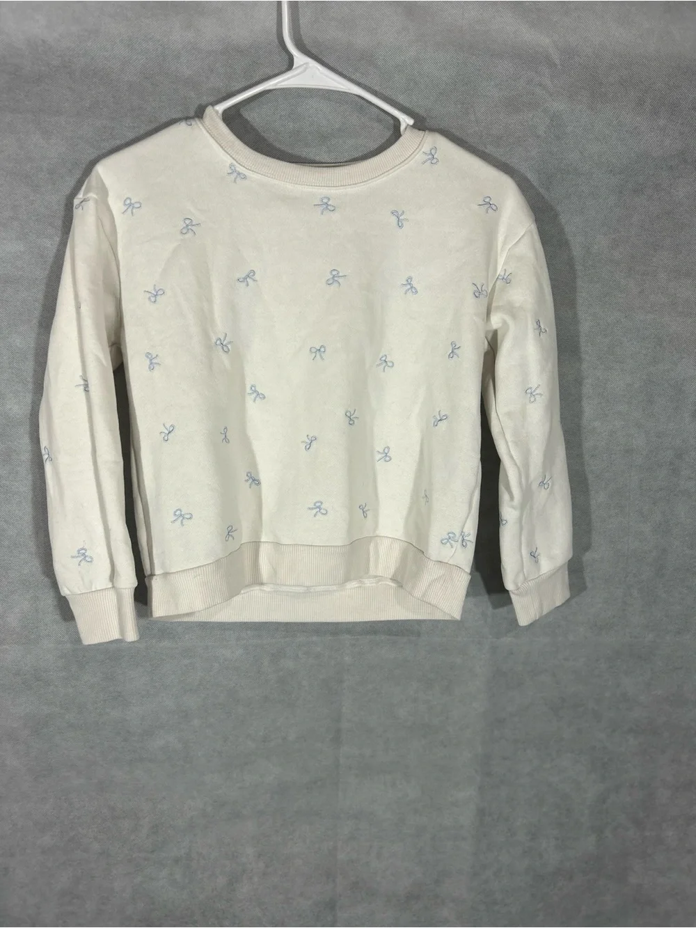 Kids Cream Crewneck Sweater with Light Blue Bow Print